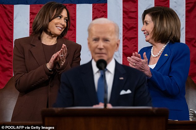 U.S. Vice President Kamala Harris (L) and U.S. House Speaker Nancy Pelosi (D-CA) applaud as U.S. President Joe Biden delivers his first State of the Union address at the U.S. Capitol in Washington, DC, March 1, 2022.