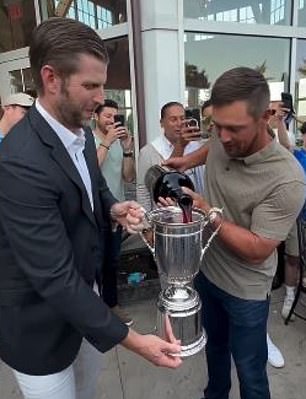 DeChambeau also celebrated his US Open victory with Trump's son Eric (left) last month.