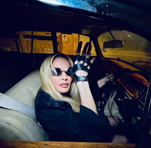 Madonna was also photographed driving in retro leather gloves with holes in the knuckles.