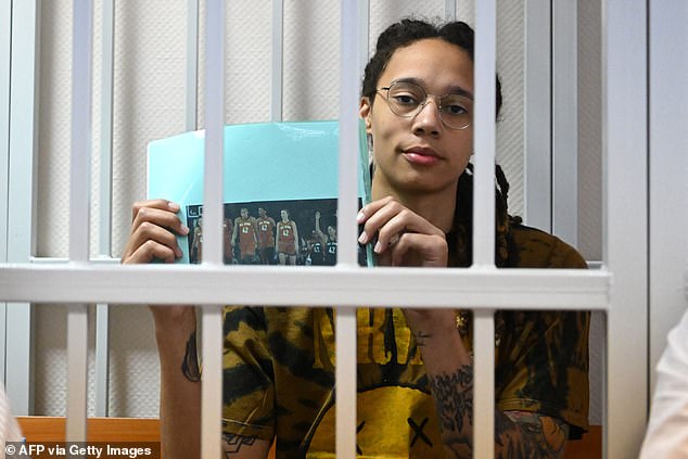 Griner sits inside the defendants' cage during a hearing at the Khimki Court, outside Moscow.