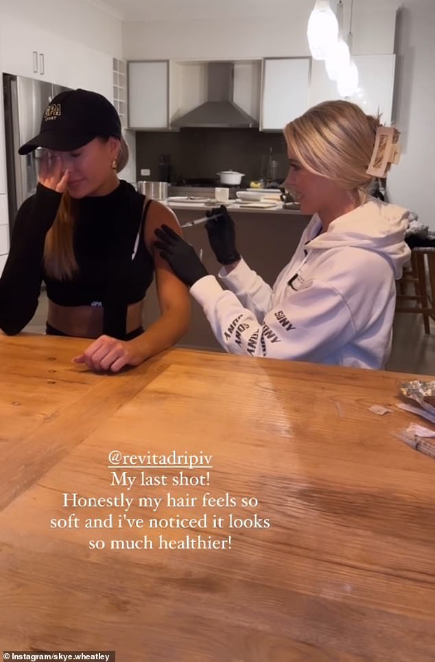 The I'm A Celebrity Australia winner posted a video on her Instagram Stories of herself sitting at her dining room table while receiving a biotin injection. She is pictured with ReVita Drip founder Ashleigh Carr.