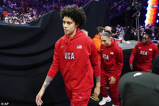 Brittney Griner, left, Diana Taurasi and Chelsea Gray of Team USA enter the court.