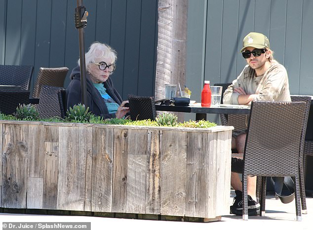 MacLaine, who is the older sister of fellow showbiz icon Warren Beatty, was photographed with her friend at an outdoor table at the cafe.