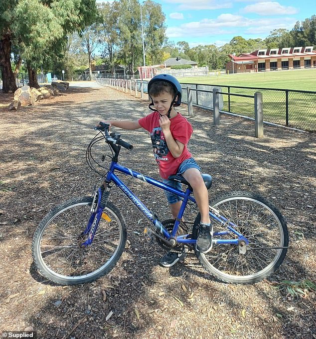 The usually active boy (pictured) has since been diagnosed with influenza-induced encephalitis with encephalopathy.