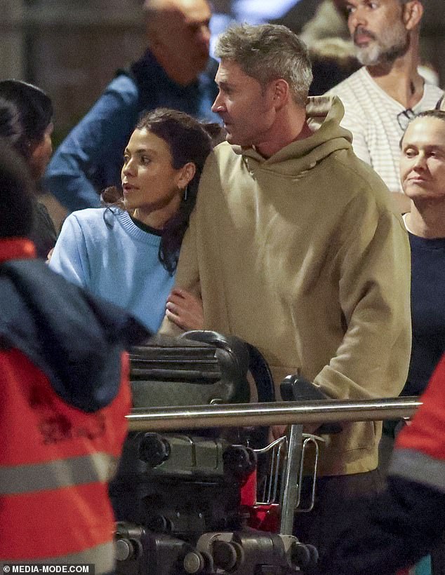 Arabella, who works for Scentre Group in Sydney, looked chic in a sky blue sweater worn over a black T-shirt tucked into baggy jeans.