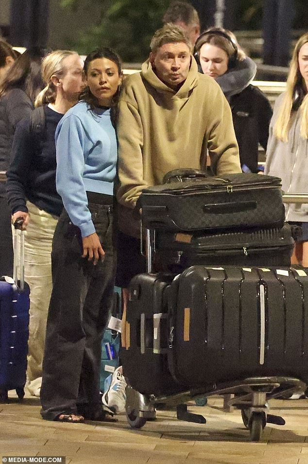 Michael Clarke and his glamorous new girlfriend Arabella Sherborne were very much in love on Monday as the lovebirds touched down at Sydney Airport.