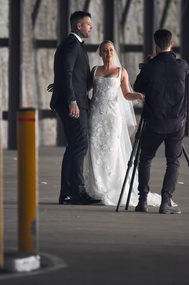 Meanwhile, his gorgeous bride looked stunning in a figure-hugging lace wedding dress.