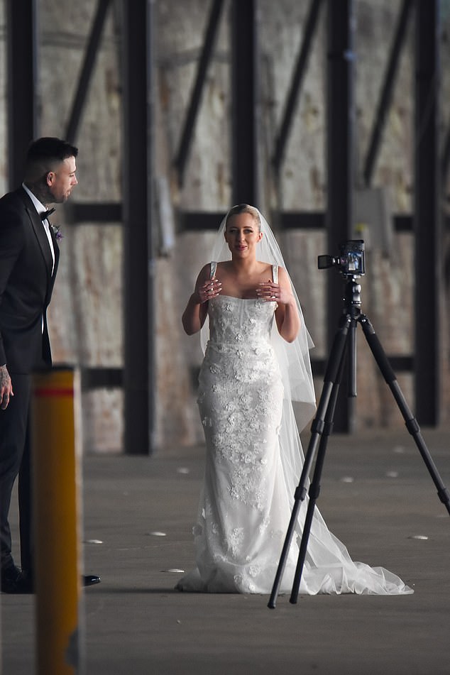 The bride looked excited and overwhelmed by the attention.