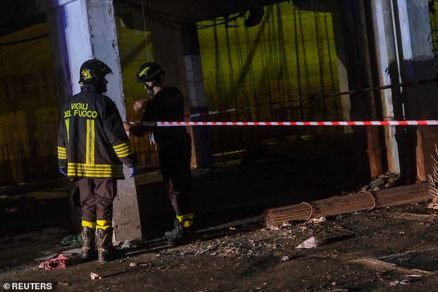 Firefighters secure the site of a balcony collapse in Naples