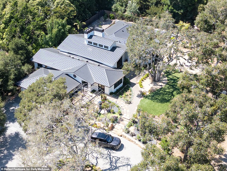 Now: Christine Baumgartner's Range Rover SUV is seen here parked outside her new rental home in a wooded area of ​​Montecito.