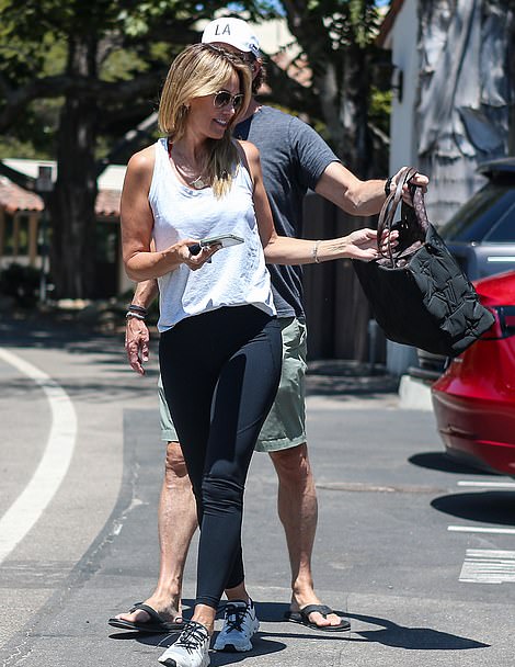 The couple held hands and joked together on a low-key date.