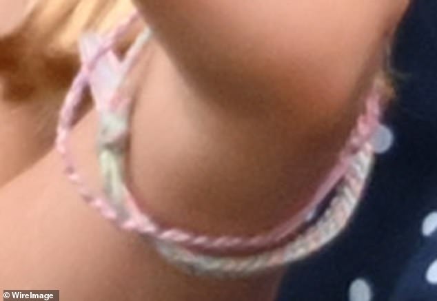 Charlotte wore two of the thread bracelets, one with various shades of pink and another with green, blue and pink fabric.