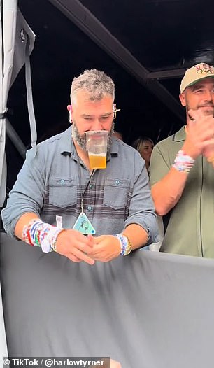 Kelce impressively held a beer in his mouth while showing off the countless amounts of bracelets on his right arm.