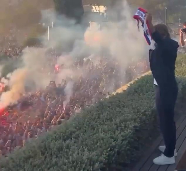 Rakitic was greeted like a hero by thousands of fans as he held up the club's scarf.