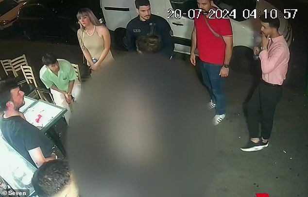 Harrowing security footage has captured the moment a visibly distraught Australian woman seeks refuge in a Paris kebab shop after being allegedly gang-raped. People are seen helping the woman, who is blurred out, outside the kebab shop.