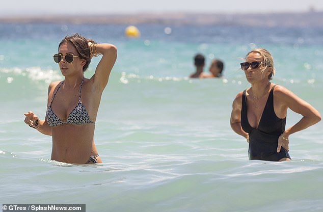 Meanwhile, Louise, who has been married to former England footballer Michael since 2005, looked nothing short of sensational in a low-cut black swimsuit.