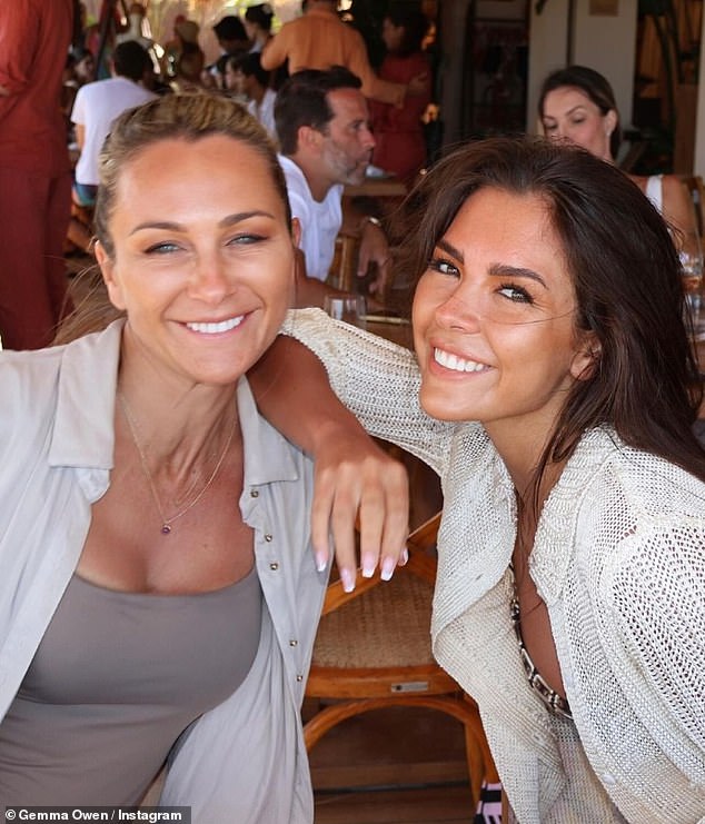 She was all smiles as she settled in to pose for a photo with her mother, who stunned in a grey swimsuit and white shirt, during a lavish lunch.