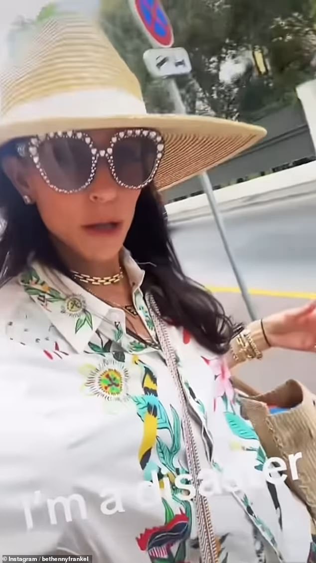 She later changed into a more comfortable ensemble, featuring brightly printed shorts, a wide-brimmed hat and large, bedazzled-framed sunglasses. 