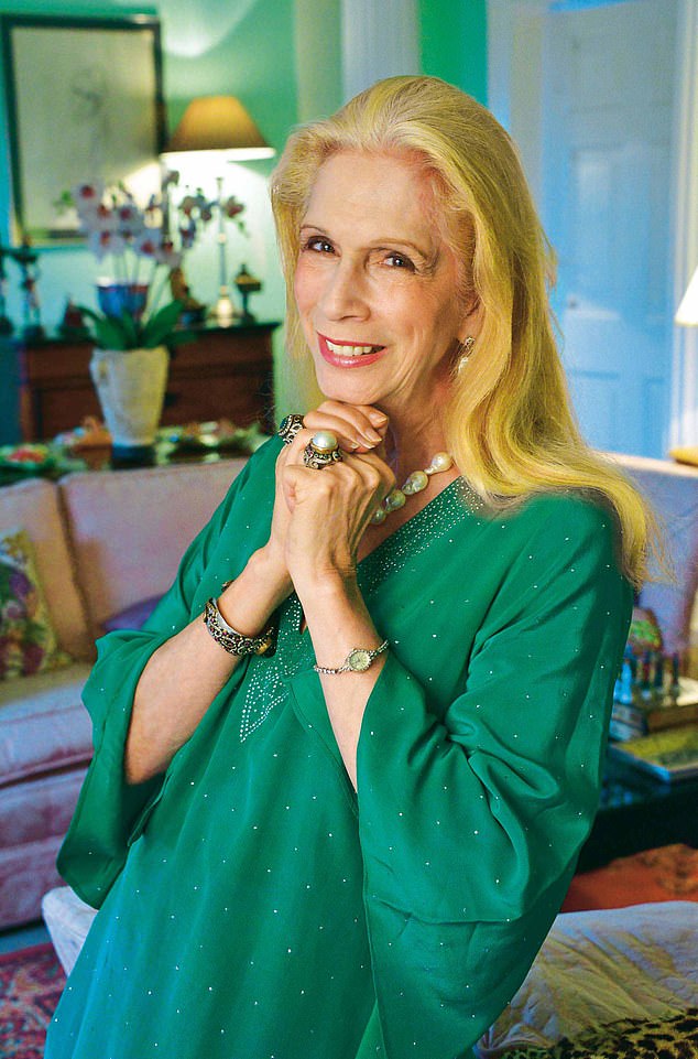 Lady Colin Campbell pictured smiling in a green blouse at her home in Castle Gorling, Sussex in 2020