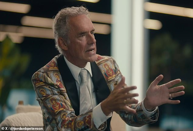 Peterson, wearing a bizarre suit jacket printed with dozens of Jesus icons, asked Musk about his switch to the Republican Party.