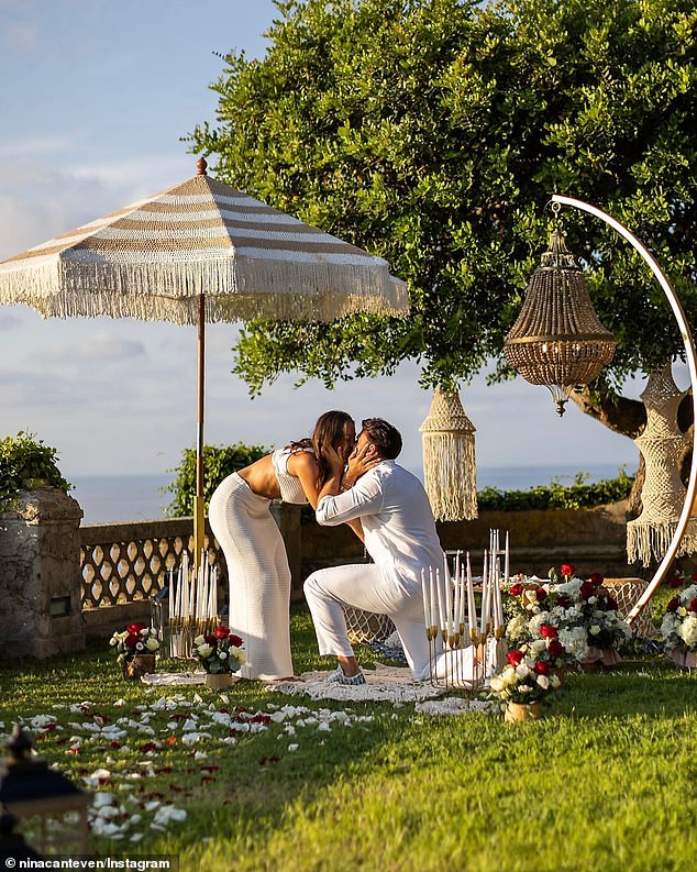 Lanterns and red and white rose petals created a path leading to where Adrian got down on one knee surrounded by stunning views of the Italian coastline.