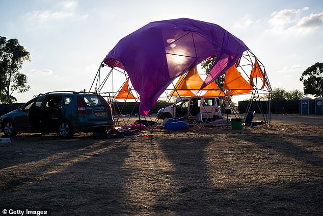 Destroyed cars and personal belongings, photographed on October 13, can still be seen on the festival grounds.