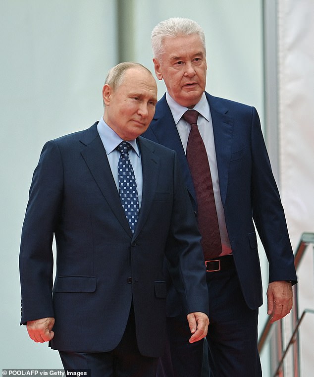 Mayor Sergei Sobyanin (pictured behind Putin) today signed a decree stating that Muscovites who agree to join Putin's bloody war in Ukraine will receive 1.9 million rubles (£16,760).