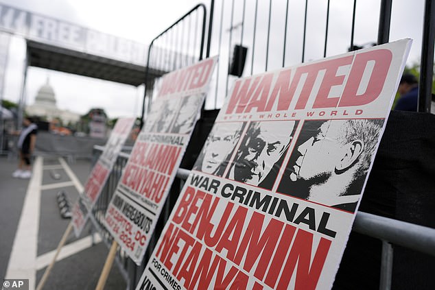 Protest signs against Benjamin Netanyahu are seen near the Capitol