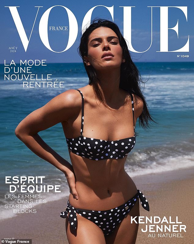 The cover photo showed Jenner in a classic black bikini with white polka dots all over, with the wind blowing through her hair.