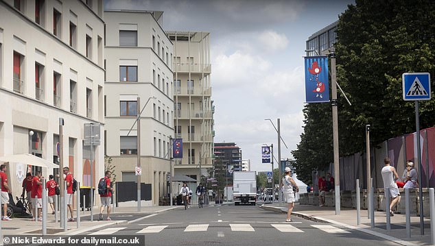 Athletes walk through the village of Saint Quen, Paris, ahead of the opening ceremony this week