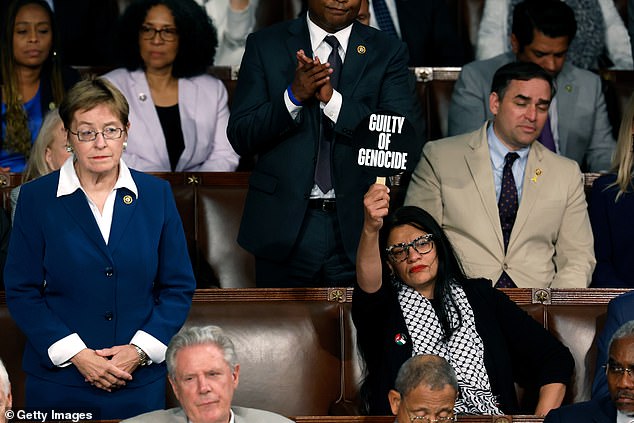 She raised her sign higher depending on the topic Netanyahu was addressing.