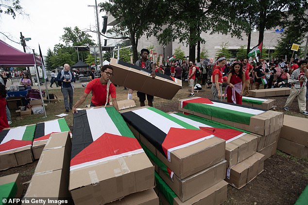 Pro-Palestinian protesters prepare cardboard coffins for a protest before Israeli Prime Minister Benjamin Netanyahu addresses a joint meeting of Congress