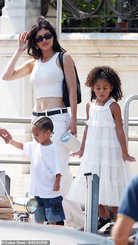 Her daughter Stormi, six, and son Aire, two, accompanied her in white outfits.