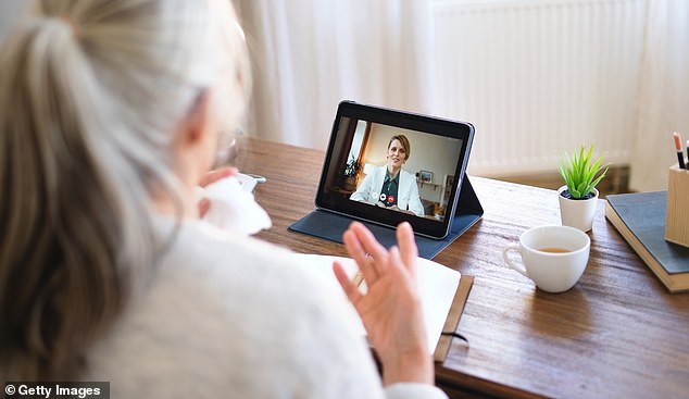 A woman has an appointment with a doctor via video call (file image)