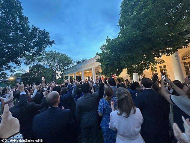 White House staff gathered in the Rose Garden to cheer the president after his speech.