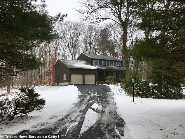 Investigators said Kosuda-Bigazzi wrapped her body in a rug and left it in the basement of his home (pictured) before continuing to collect her wages until his arrest in February 2018.