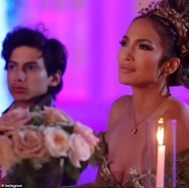 Her 16-year-old son Max was photographed sitting next to her at the candlelit dinner table.