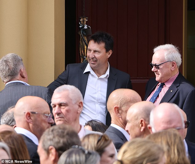 Morrow, whose radio career spanned half a century, died of brain cancer aged 71 on July 17 and was given a farewell in style on Thursday at St Brigid's Catholic Church in Coogee. Rugby league great Laurie Daley is pictured centre-stage.