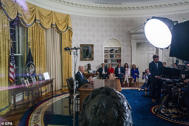 From right to left: Jill Biden, Ashley Biden and her husband Howard Kerin, and Hunter Biden and his daughter Finnegan listen to Joe Biden speak.