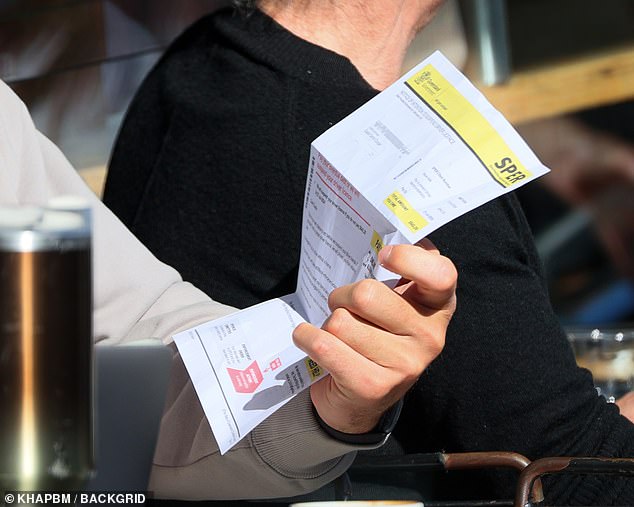 Cooper was seen reading a letter from the Queensland government informing him that his licence could be suspended unless he paid a substantial amount.