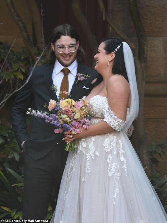 In pictures obtained by Daily Mail Australia, the quirky couple looked very happy with their partner as they smiled from ear to ear and gave off a very loving display.