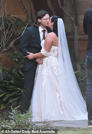 The newlyweds proved there was an initial spark when they shared a kiss while a videographer was taking pictures of them on their wedding day.