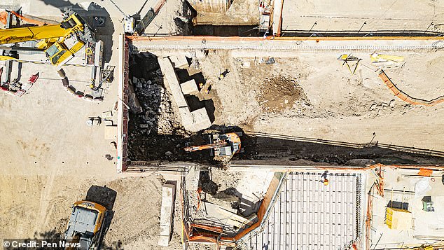 The discovery includes a brick and travertine marble wall that once formed a terrace over the River Tiber, with the foundations of a columned portico behind it.