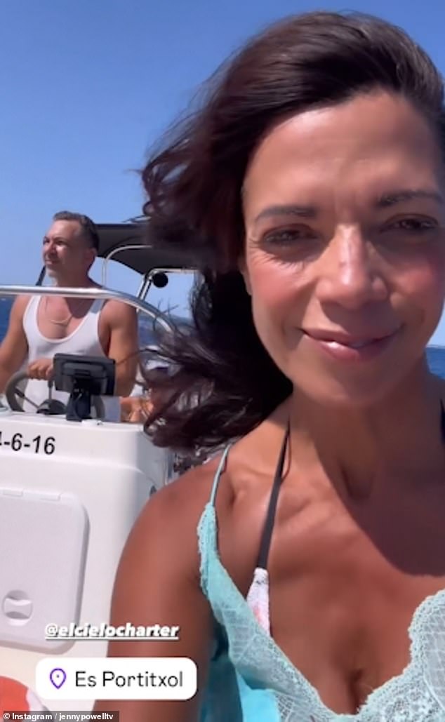 In a video posted to the star's story, she gave her followers a glimpse of her day trip on a boat in San Antonio, where she wore a turquoise dress over a black and white patterned bikini.