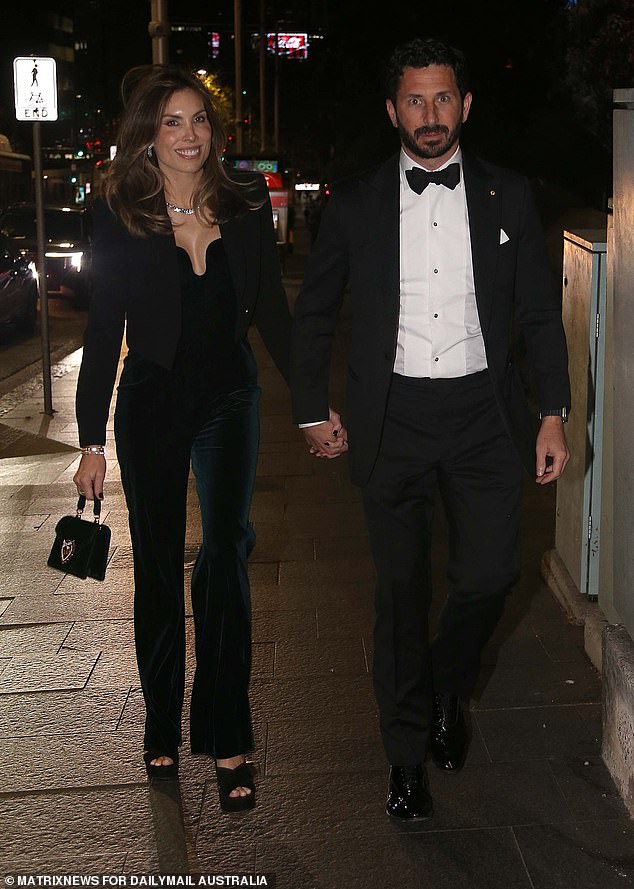 Media mogul Ryan Stokes (pictured right) and his wife Claire (pictured left) looked dapper in their black and white formal attire.