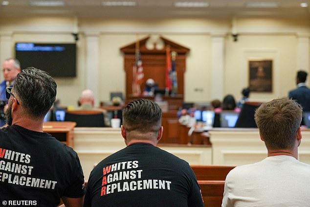 Members of the Goyim Defense League hate group sit during a city council session in Nashville, Tennessee, July 16, 2024.