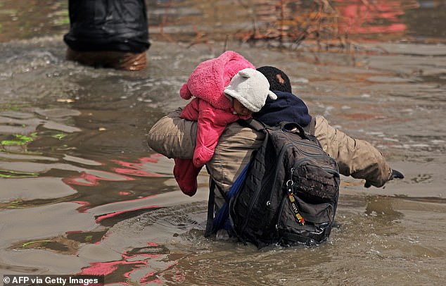 Migrants attempt to cross the Rio Grande from Ciudad Juarez, Chihuahua state, Mexico, on February 29, 2024