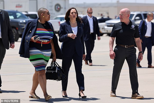 US Vice President Kamala Harris walks with Department of Homeland Security (DHS) Secretary Alejandro Mayorkas and spokeswoman Symone Sanders