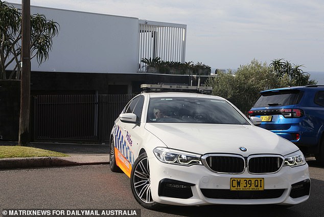 A police car patrolled George Street outside Ibrahim's home on Thursday after the arrests.