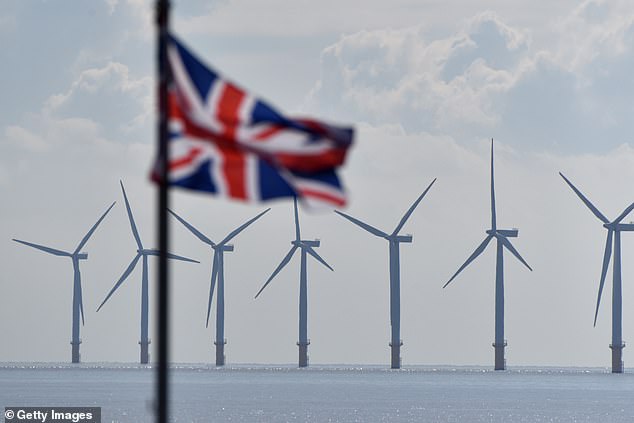 Gunfleet Sands offshore wind farm with the British flag flying in front of them